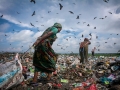The women and men is pulled out valueless Waste after picked saleable materials. The permanent Waste land under Sylhet City Corporation. Lalmatia, Sylhet, Bangladesh.